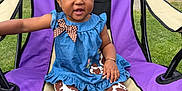 Kycee joined the competition — help win amazing prizes! toddler, child, outdoor, chair, blue_dress, polka_dot_bow, cow_print_leggings, grass, blanket, purple_chair, smiling, barefoot, curly_hair, bracelet, earrings, sunny_day, park, playful, happy, person