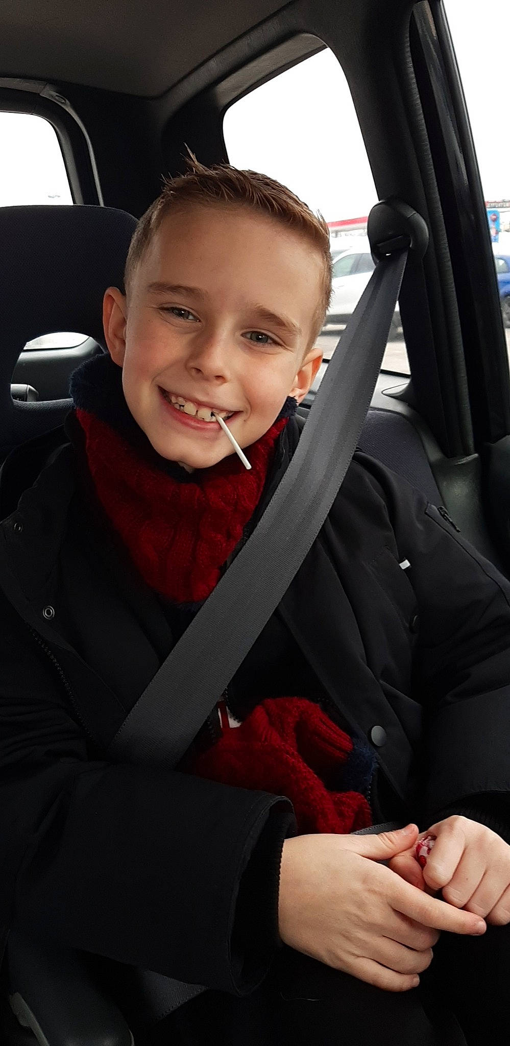 Kristian is registered to the contest to win money with this photo: auto_part, automotive_design, automotive_exterior, car, car_seat, car_seat_cover, face, facial_expression, finger, flash_photography, hand, joy, motor_vehicle, outerwear, person, seat_belt, smile, steering_part, steering_wheel, vehicle