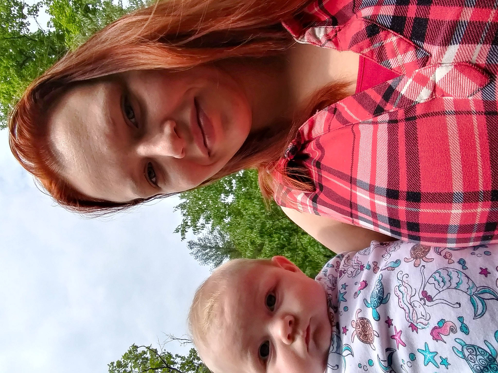 Saria joined the competition — help win amazing prizes! chin, eye, face, facial_expression, green, human, light, lip, mouth, neck, nose, organ, people_in_nature, person, photograph, plant, skin, smile, tartan, tree