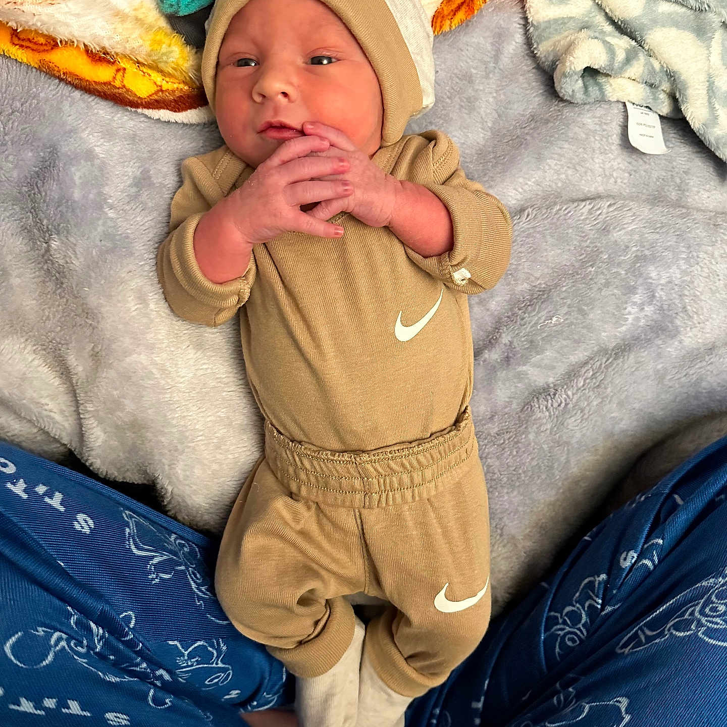 Dezmond is registered to the contest to win money with this photo: baby, bed, bedroom, blanket, cap, clothing, couch, face, furniture, hat, head, indoors, newborn, pants, person, photography, portrait, quilt, room, sleeping