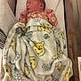 baby, bed, blanket, child, cozy, crib, cute, floral_clothing, indoors, infant, newborn, patterned_blanket, peaceful, person, portrait, resting, sleeping, soft_texture, winnie_the_pooh, wooden_crib