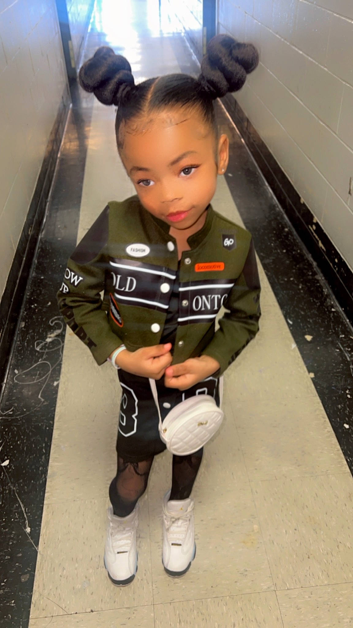 Samoraa is registered to the contest to win money with this photo: boot, eye, face, floor, flooring, formal_wear, human_leg, knee, leg, person, shoe, shorts, sleeve, sneakers, sock, sportswear, suit, thigh, tie, toddler