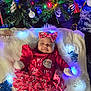 Izabella joined the competition — help win amazing prizes! baby, infant, christmas, christmas_tree, ornament, lights, headband, bow, dress, santa_graphic, blanket, faux_fur, mittens, ruffle_skirt, snowflake, festive, holiday, cozy, eyes_closed, smiling