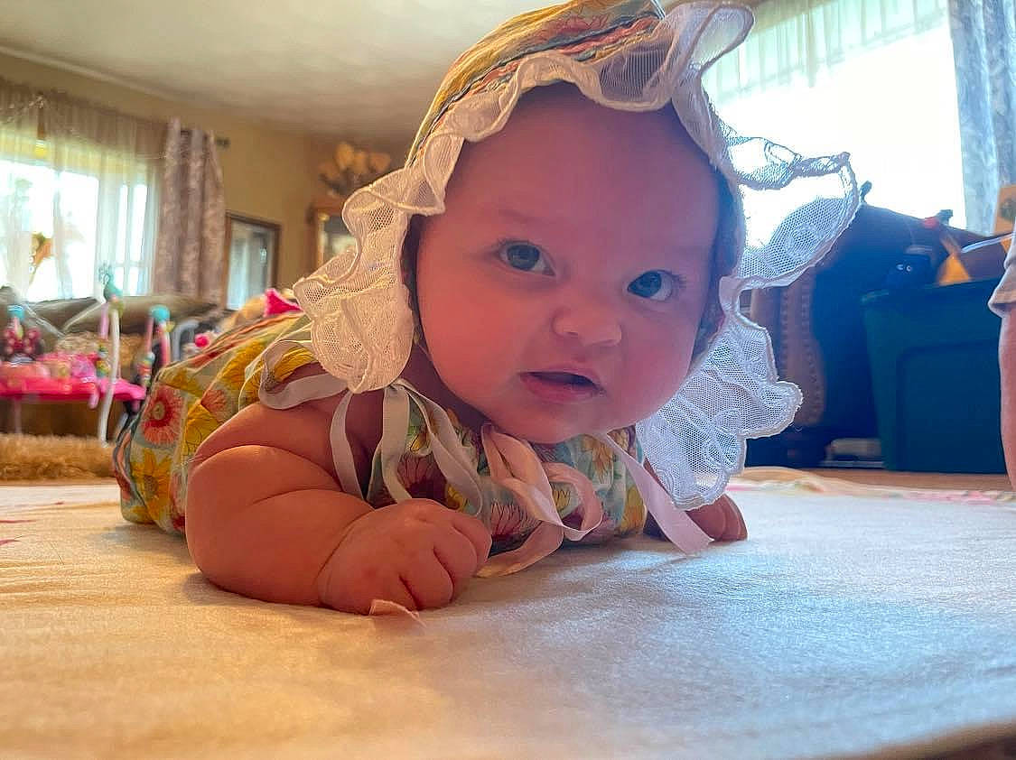 Freyja Rose joined the competition — help win amazing prizes! baby, cheek, child, comfort, crawling, curtain, floor, flooring, fun, happy, headgear, headwear, leisure, mouth, person, pink, skin, textile, toddler, tummy_time