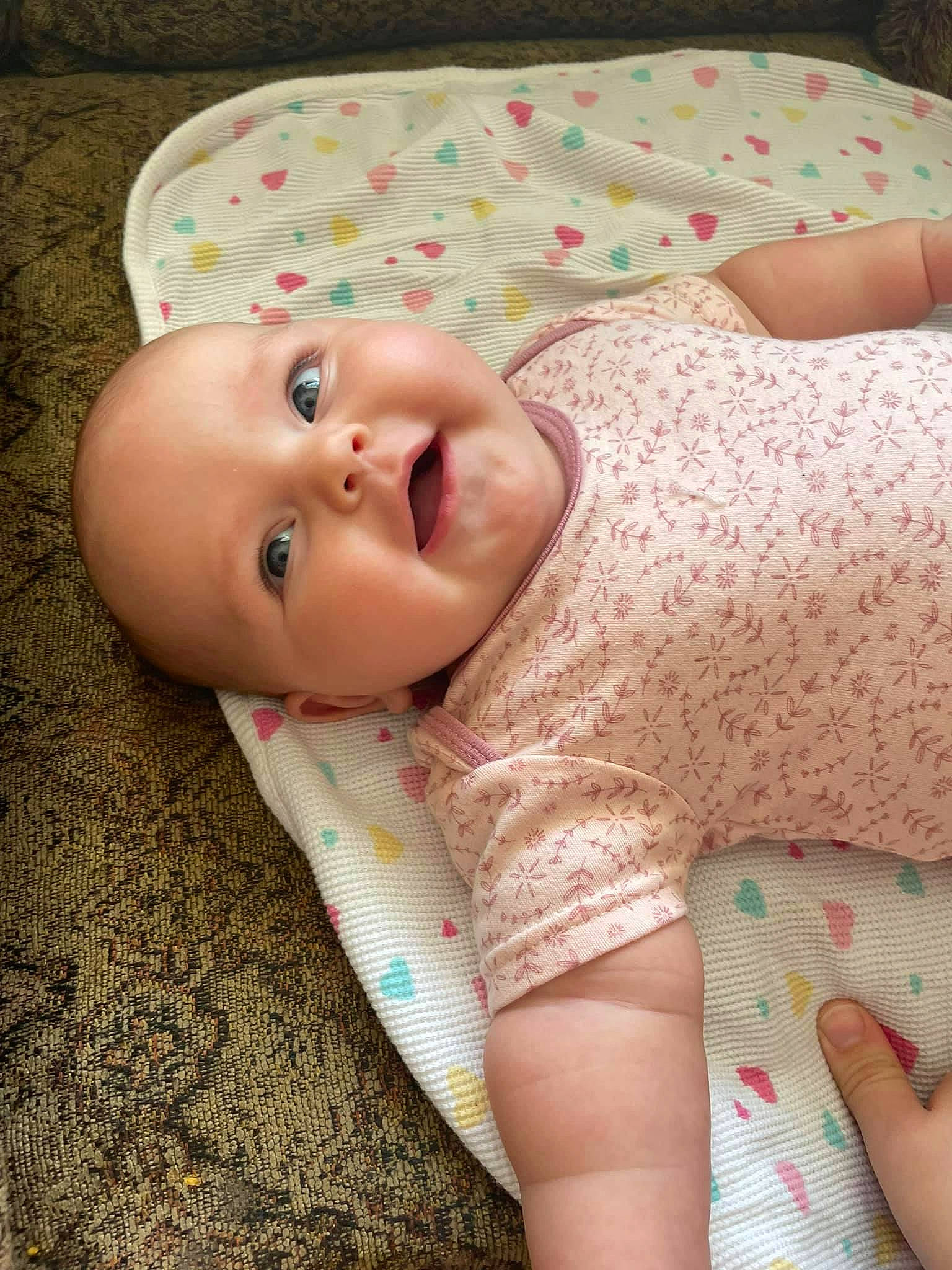 Freyja Rose joined the competition — help win amazing prizes! baby, baby_toddler_clothing, cheek, child, comfort, grass, headgear, human_body, iris, linens, lip, neck, nose, pattern, person, pink, skin, sleeve, smile, textile