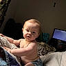 Gracen joined the competition — help win amazing prizes! baby, child, indoor, bed, blanket, pillow, light_hair, curious, sleepy, person, television, room, furniture, soft_light, casual, home, comfort, candid, portrait, infant