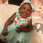 Malina is registered to the contest to win money with this photo: baby, smiling, infant, cute, headband, dress, tulle_skirt, bed, blanket, elephant, clothing, happy, child, portrait, indoor, soft_toys, fabric, skin, person, baby_girl
