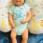 Mazen is registered to the contest to win money with this photo: baby, cap, clothing, cushion, face, footwear, furniture, glove, hat, head, homedecor, hosiery, newborn, pants, person, photography, portrait, shorts, sleeping, sock