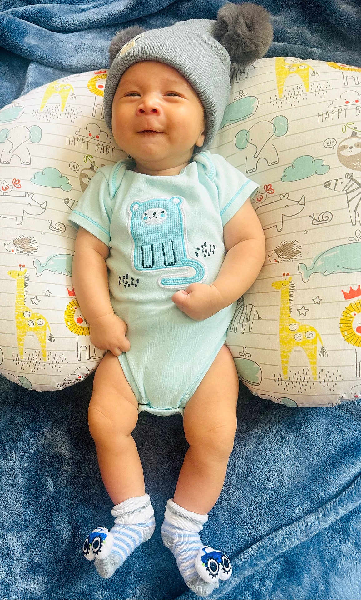 Mazen is registered to the contest to win money with this photo: baby, cap, clothing, cushion, face, footwear, furniture, glove, hat, head, homedecor, hosiery, newborn, pants, person, photography, portrait, shorts, sleeping, sock