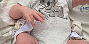 Wesley is registered to the contest to win money with this photo: baby, baby_seat, blanket, child, closeup, cushion, face, foot, hand, happy, head, infant, koala_print, mickey_mouse, onesie, outdoor, person, reaching, smiling, toy