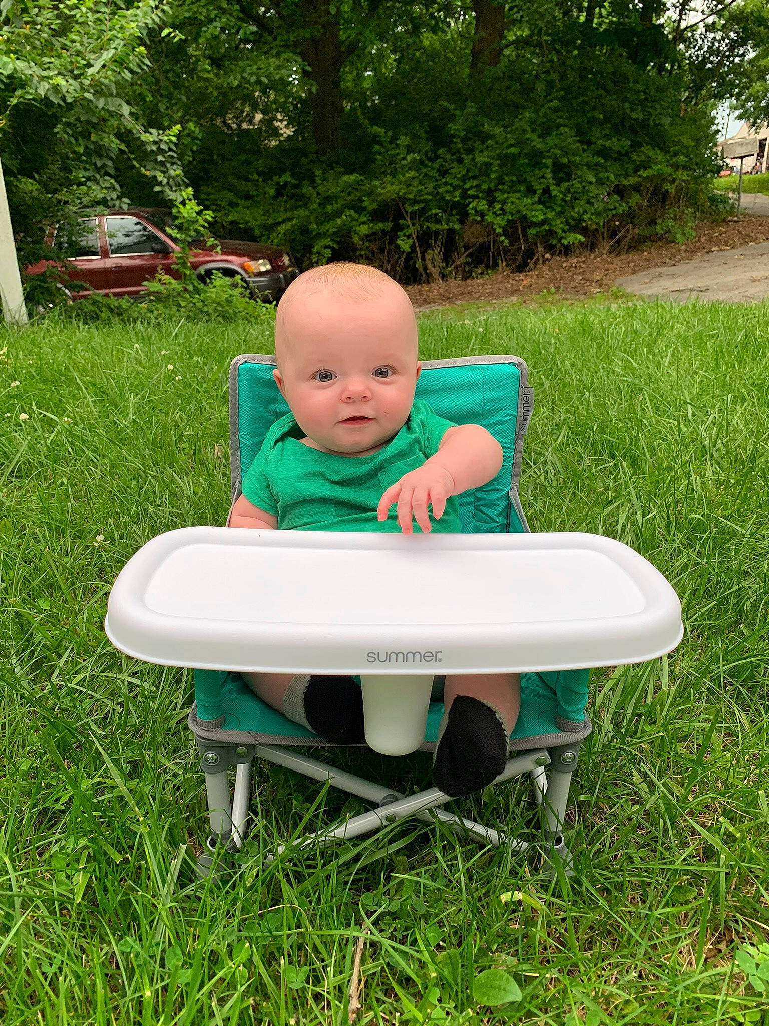 Bentley joined the competition — help win amazing prizes! baby, baby_toddler_clothing, chair, child, fun, garden, grass, happy, lawn, leisure, outdoor_furniture, people_in_nature, person, plant, recreation, shrub, sitting, table, terrestrial_plant, toddler