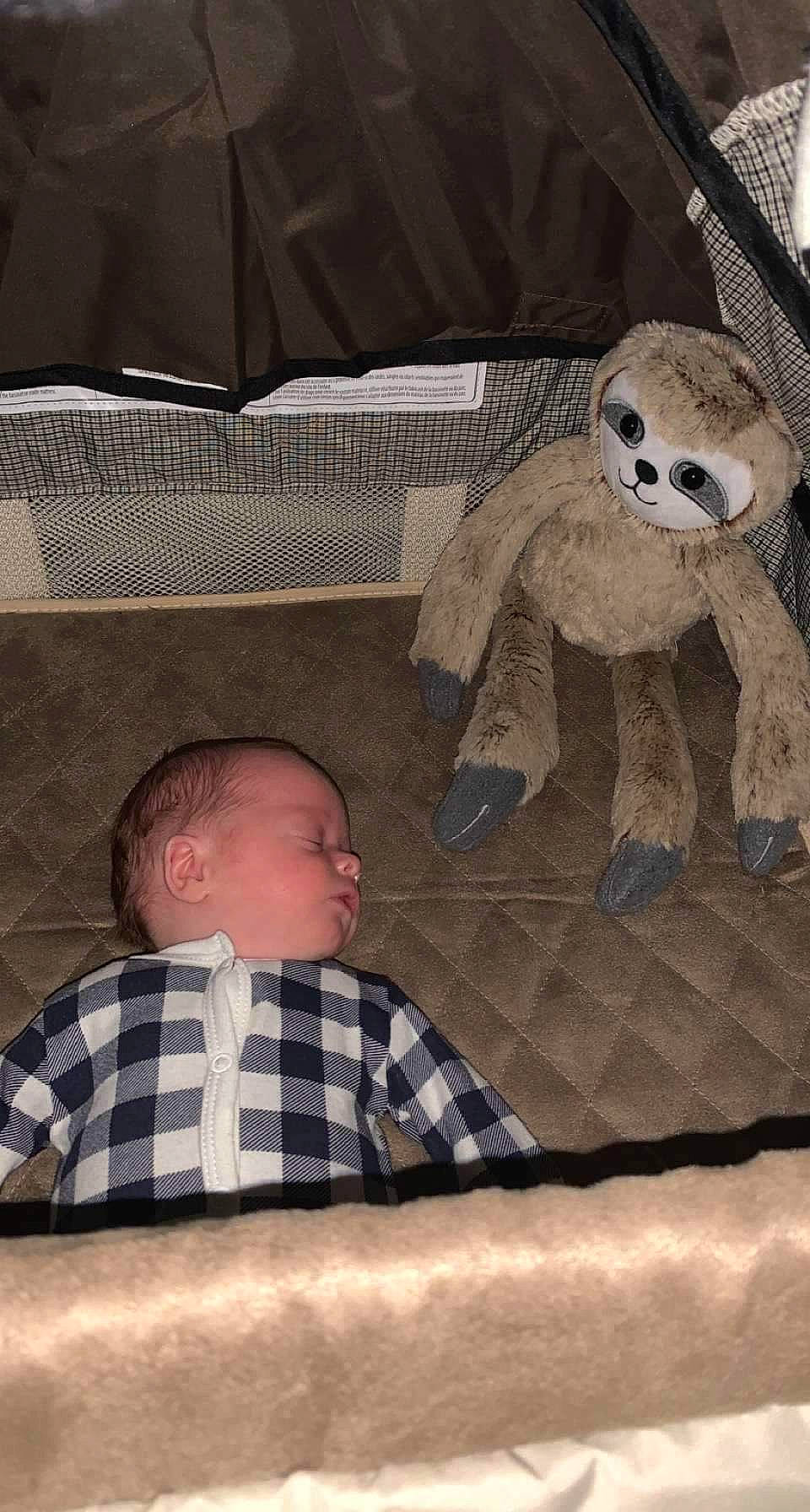 Bentley is registered to the contest to win money with this photo: art, baby, baby_toddler_clothing, black, bone, child, comfort, flooring, infant_bed, linens, pattern, person, room, sitting, skull, stuffed_toy, table, textile, toddler, toy
