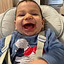 Marco participe au concours pour gagner de l'argent avec cette photo : baby, smiling, child, high_chair, blue_clothing, happy, indoors, face, infant, furniture, person, teeth, hand, straps, seat, cushion, portrait, cute, room, living_room