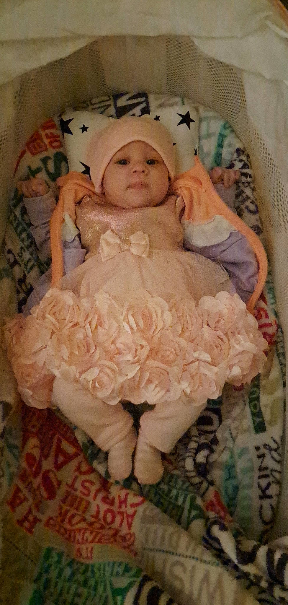 Brianna joined the competition — help win amazing prizes! baby, baby_products, baby_toddler_clothing, bridal_accessory, cheek, child, comfort, dress, embellishment, fashion_accessory, hair_accessory, headpiece, headwear, linens, peach, person, petal, pink, room, ruffle