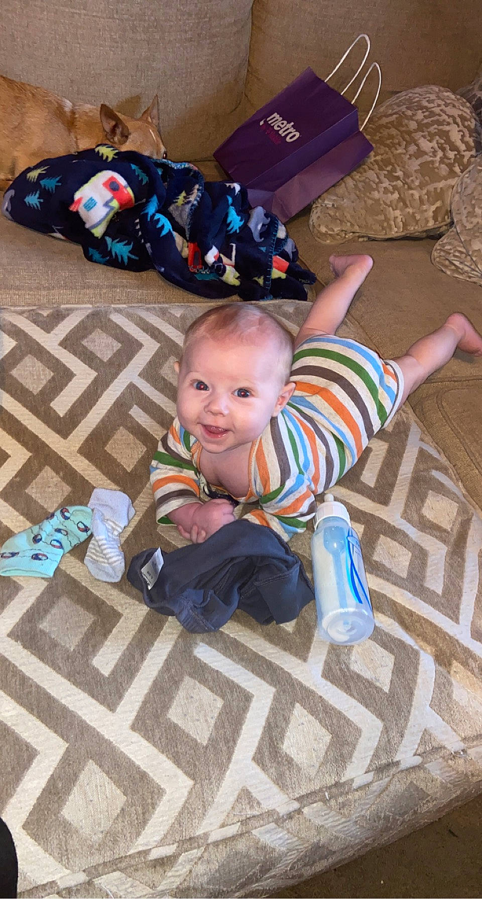 Jasiah joined the competition — help win amazing prizes! baby, baby_toddler_clothing, blue, child, comfort, floor, flooring, fun, grass, happy, leisure, person, play, road_surface, sidewalk, sitting, smile, sock, toddler, travel