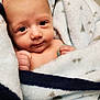 Dallas joined the competition — help win amazing prizes! baby, blanket, infant, face, skin, hand, cozy, soft, cute, newborn, wrapped, comfort, expression, child, portrait, indoors, warm, cute_face, small, peaceful