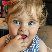 Louise participe au concours pour gagner de l'argent avec cette photo : baby, blond_hair, blue_eyes, child, close_up, curious, curly_hair, cute, expression, face, finger_in_mouth, hand, indoor, person, portrait, skin, sleeveless_top, striped_clothing, toddler, young_child