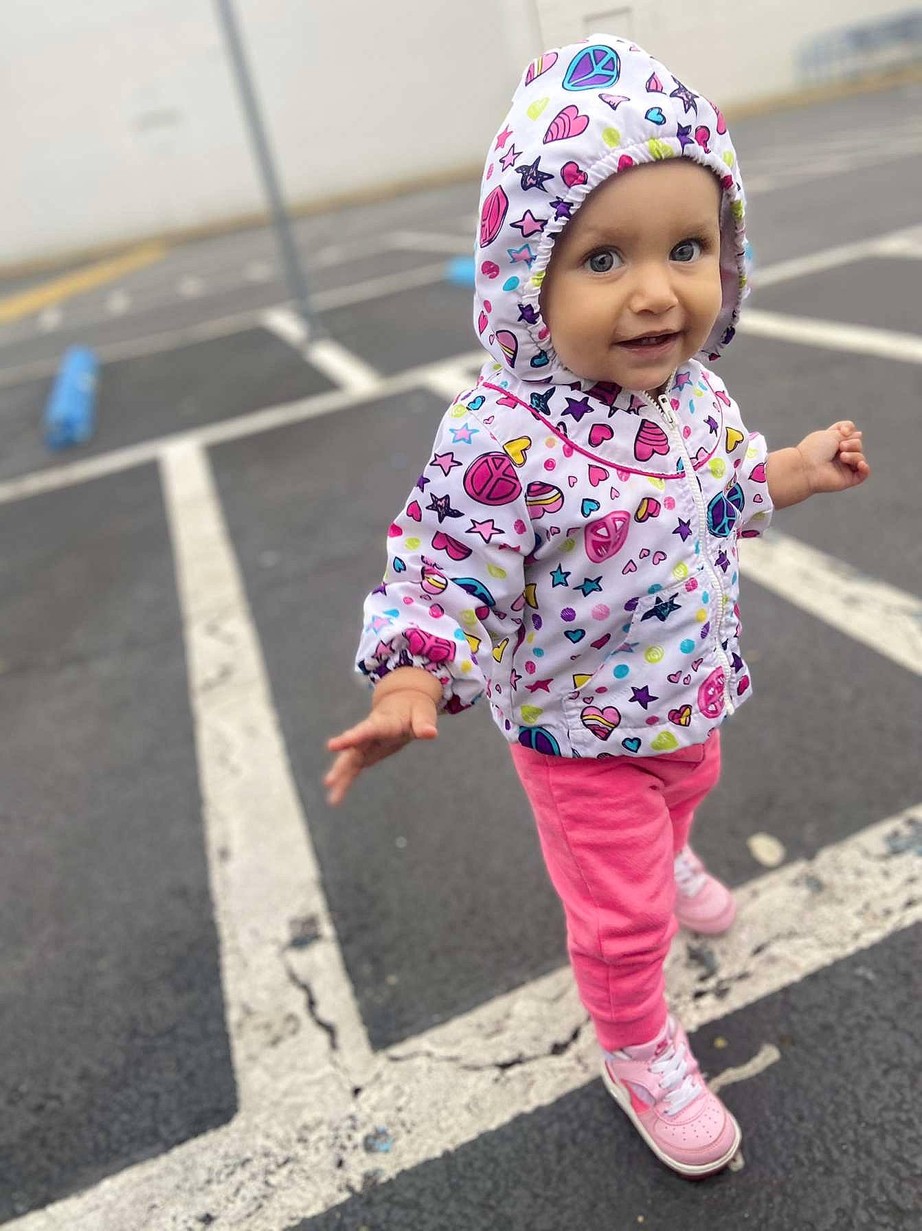 Makennah is registered to the contest to win money with this photo: asphalt, baby, baby_toddler_clothing, bonnet, child, headwear, magenta, person, pink, purple, sleeve, tar, toddler, walking_shoe