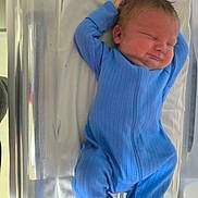 Samuel joined the competition — help win amazing prizes! newborn, baby, sleeping, blue_onesie, hospital_bassinet, infant, cozy, peaceful, child, resting, bed, blanket, face, person, cute, young, happy, indoors, healthcare, soft