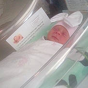 Jaylin Marie Clark joined the competition — help win amazing prizes! newborn, baby, infant, hospital, bassinet, blanket, hat, bunny_ears, sleeping, face, person, bed, medical_note, sheet, indoors, cute, resting, child, healthcare, swaddled