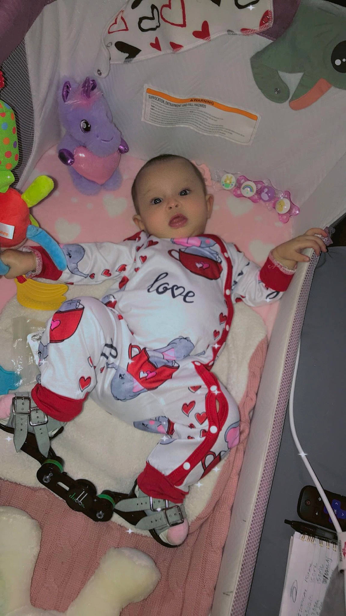 Karma is registered to the contest to win money with this photo: art, baby, baby_products, baby_toddler_clothing, carmine, chair, cheek, child, fictional_character, fun, happy, magenta, pattern, person, pink, room, sleeve, t_shirt, textile, thigh