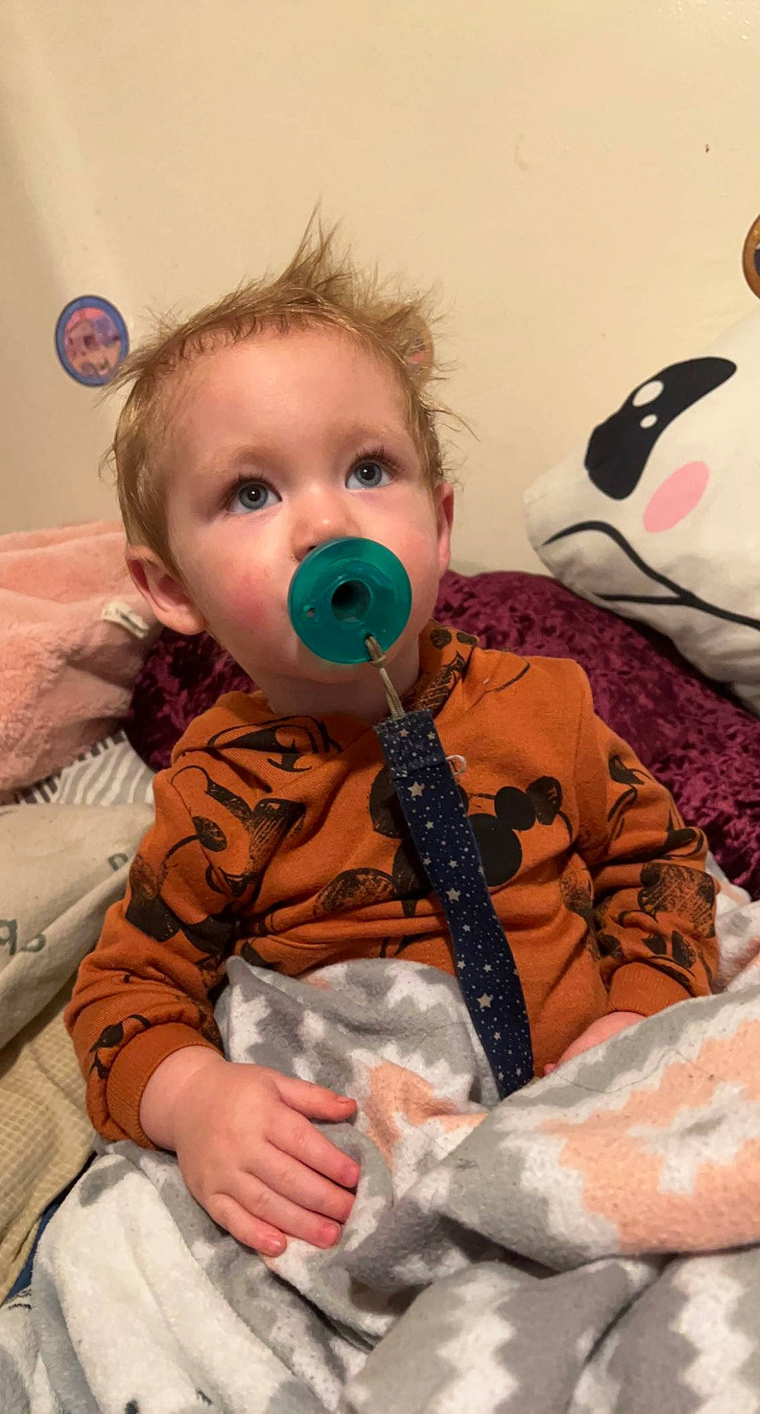 Grayson is registered to the contest to win money with this photo: baby, baby_toddler_clothing, cheek, child, comfort, eye, eyelash, fun, happy, head, iris, linens, mouth, nose, person, room, sitting, skin, stuffed_toy, textile