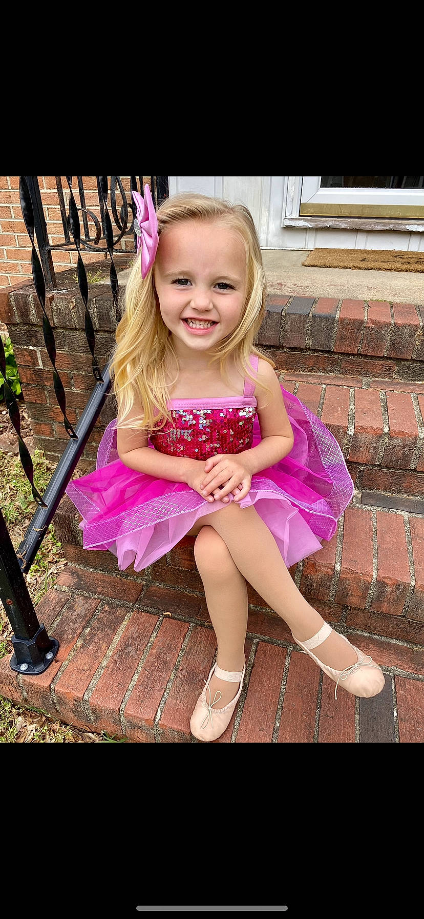 Rylan joined the competition — help win amazing prizes! brick, child, clothing, costume, dress, eveningdress, face, female, footwear, girl, head, path, person, photography, portrait, purple, sandal, shoe, sitting, skirt