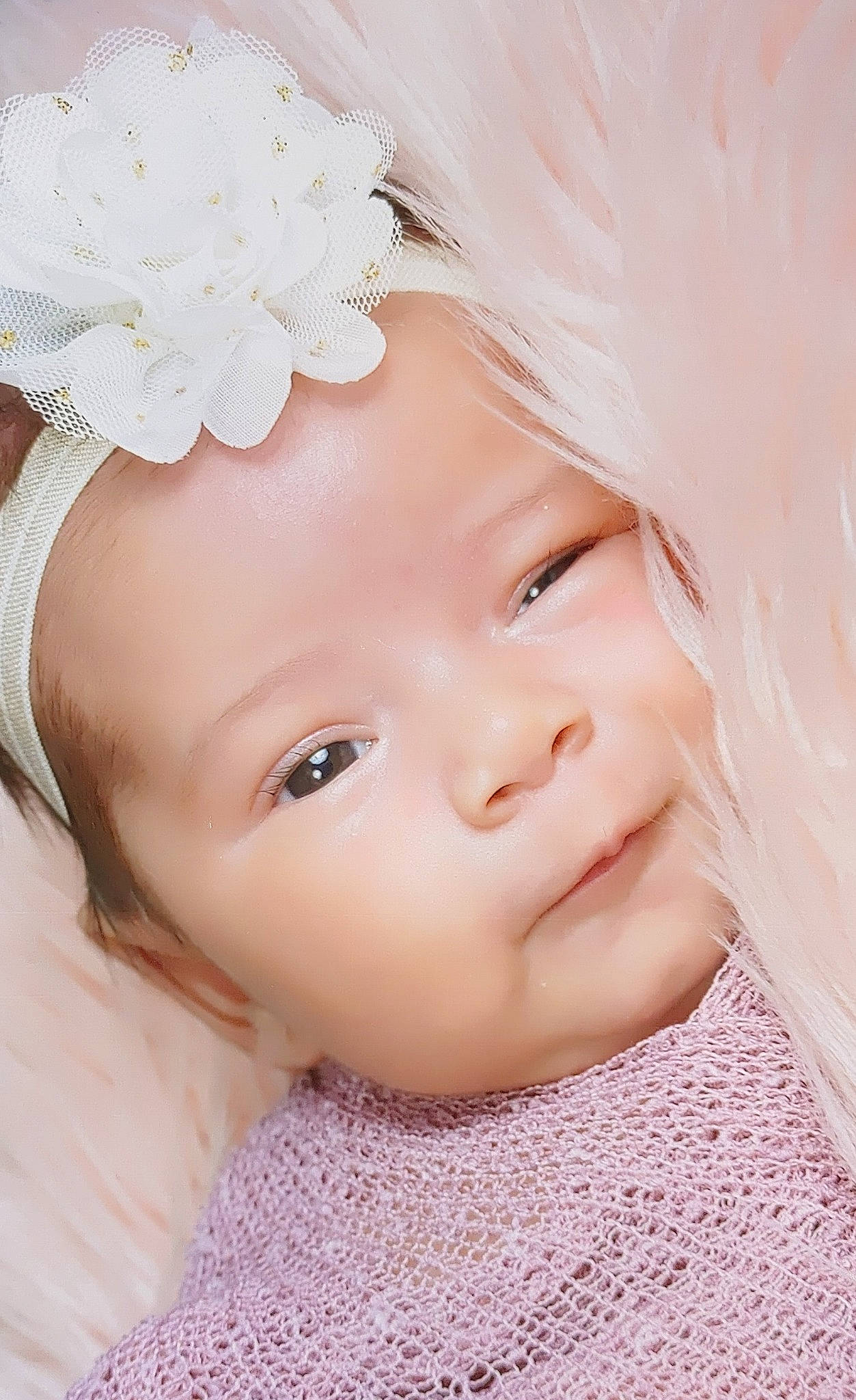 Alondra is registered to the contest to win money with this photo: baby_toddler_clothing, chin, dress, embellishment, eye, eyebrow, eyelash, face, hair, hand, happy, head, headgear, headwear, iris, lip, person, petal, pink, skin