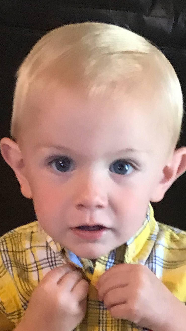 Gunner is registered to the contest to win money with this photo: baby, baby_toddler_clothing, biting, cheek, child, chin, ear, eyebrow, eyelash, facial_expression, finger, forehead, fun, iris, lip, mouth, nose, organ, person, skin