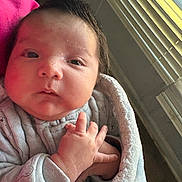 Adrian is registered to the contest to win money with this photo: baby, newborn, infant, face, hand, blanket, cozy, indoors, window, light, curious, wrapped, soft, portrait, child, sleepwear, cute, human, person, skin