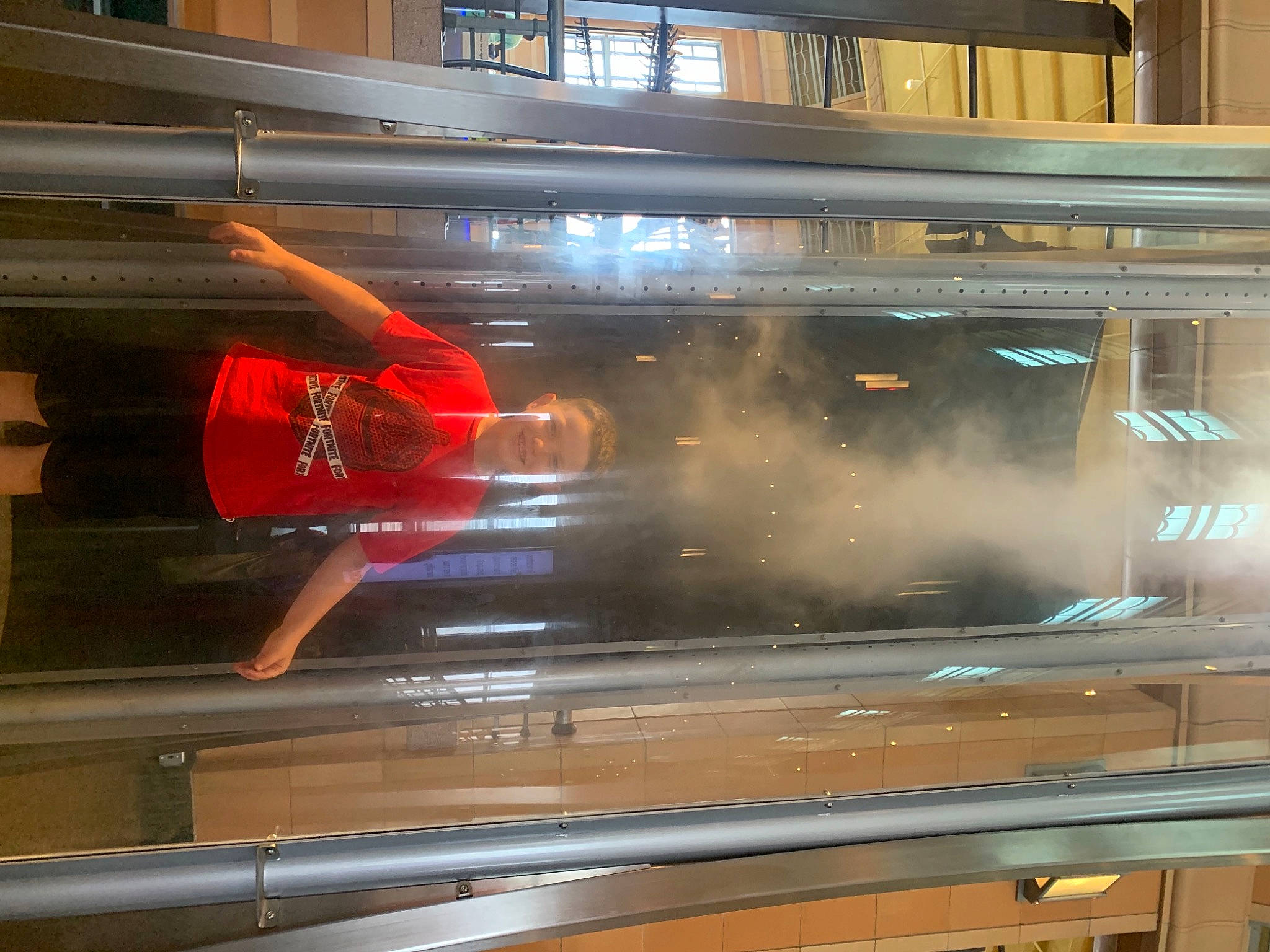 Landyn is registered to the contest to win money with this photo: automotive_exterior, automotive_lighting, building, composite_material, display_case, display_device, flooring, gas, glass, hardwood, heat, home_appliance, joy, kitchen_appliance, light, machine, metal, person, rectangle, room