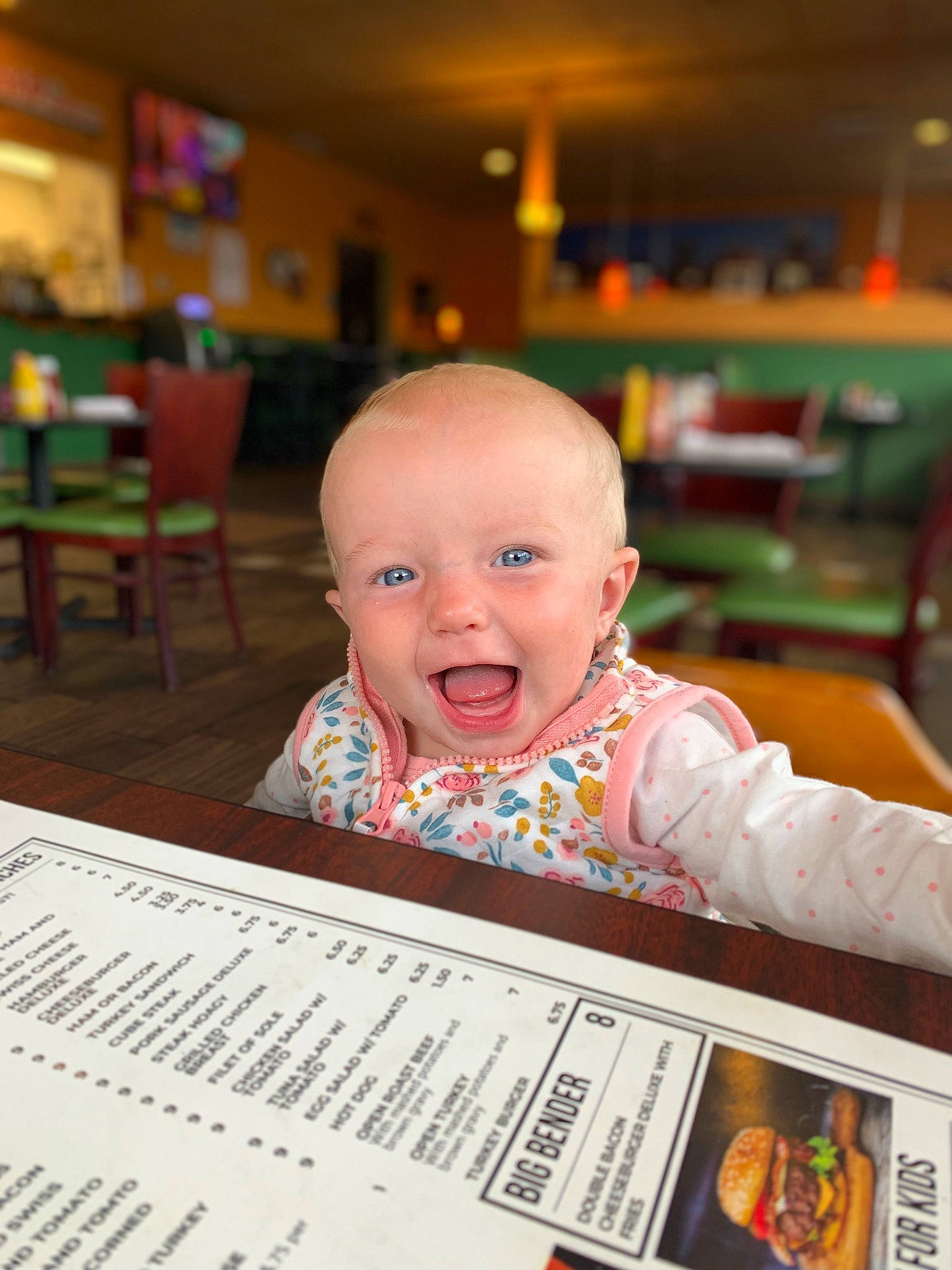 Paisley Rae is registered to the contest to win money with this photo: baby, baby_toddler_clothing, chair, cheek, child, flooring, font, fun, happy, menu, person, portrait_photography, product, publication, room, sitting, smile, toddler, wood