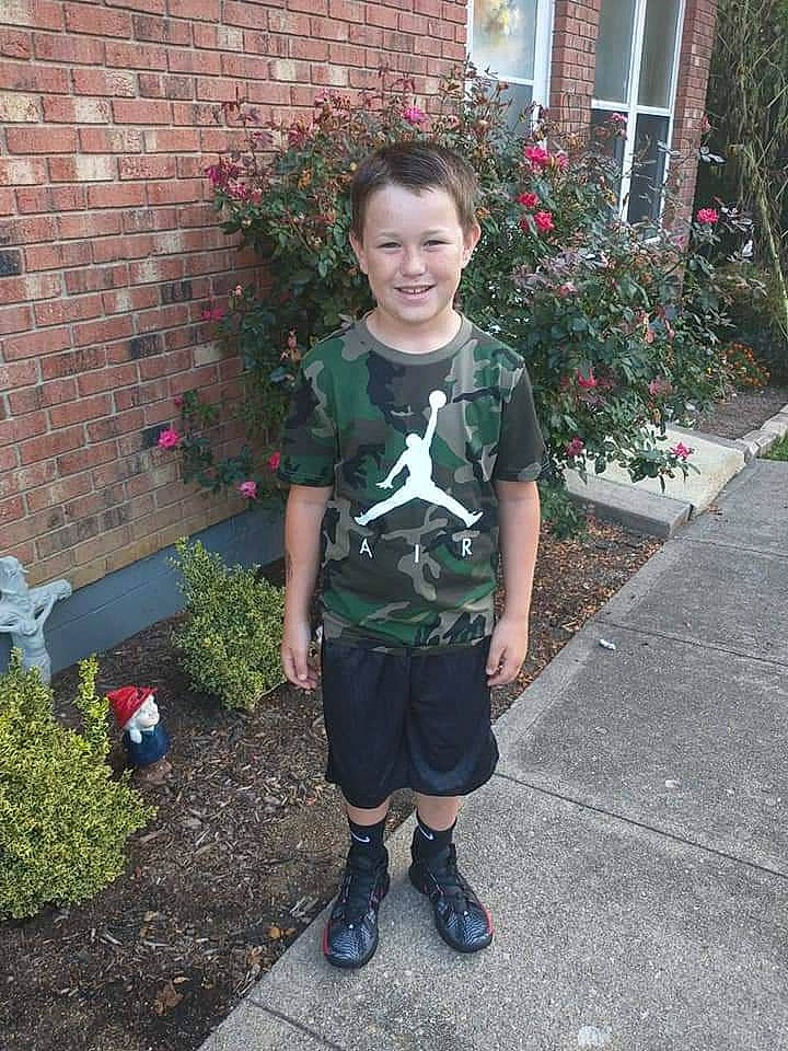 Camdyn joined the competition — help win amazing prizes! annual_plant, brick, brickwork, fun, garden, grass, human_body, joy, landscaping, leaf, magenta, pattern, person, plant, shorts, shrub, sleeve, smile, t_shirt, toddler