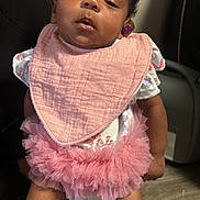 Brigette joined the competition — help win amazing prizes! baby, child, pink_bib, pink_tutu, headband, white_socks, person, indoor, floor, hand, clothing, fabric, cute, sleepy, infant, tulle, accessory, human, portrait, holding