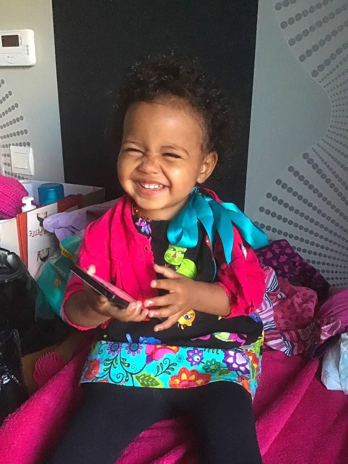 Madysson participe au concours pour gagner de l'argent avec cette photo : chair, child, cool, event, fashion_accessory, fun, happy, iris, jewellery, joy, laugh, magenta, person, pink, play, room, sitting, skin, smile, t_shirt