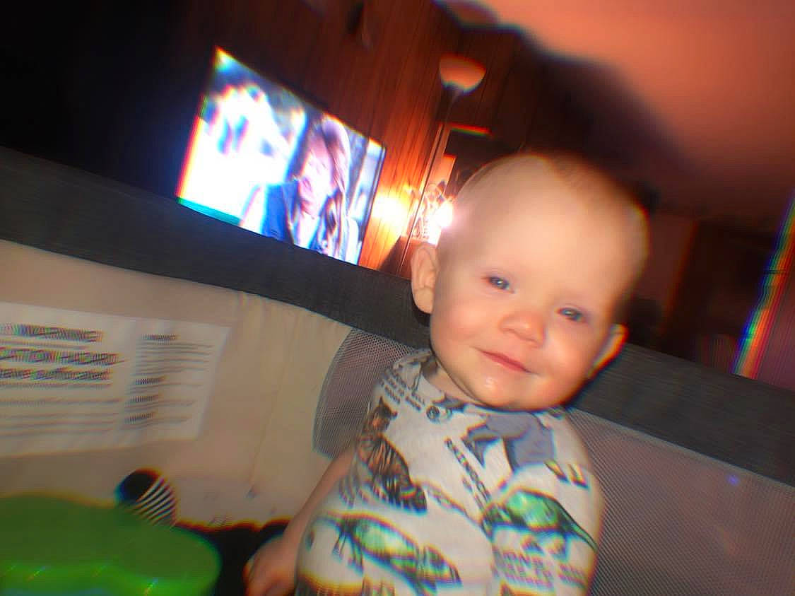 Cason joined the competition — help win amazing prizes! audio_equipment, baby, child, display_device, electronic_device, fun, gadget, games, indoor_games_and_sports, joy, leisure, person, recreation, room, sitting, smile, space, t_shirt, technology, television_set