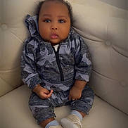 Lucas joined the competition — help win amazing prizes! baby, child, infant, couch, clothing, hoodie, camouflage, shoes, socks, sitting, face, portrait, cute, indoor, furniture, expression, person, young, cozy, curious