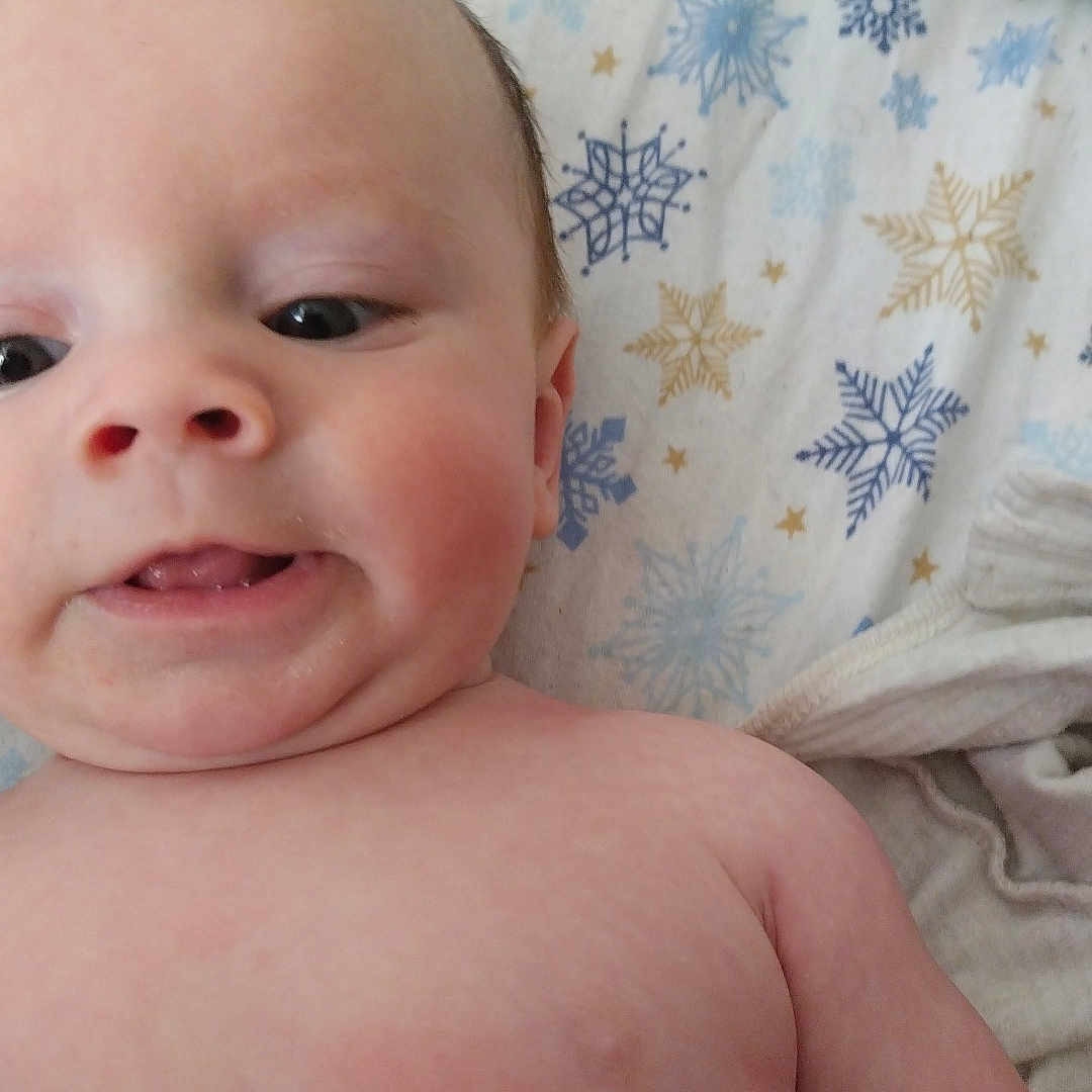 Easton joined the competition — help win amazing prizes! baby, bed, bedroom, blanket, bodypart, crib, cushion, face, furniture, head, homedecor, indoors, infantbed, mouth, newborn, person, photography, portrait, quilt, room