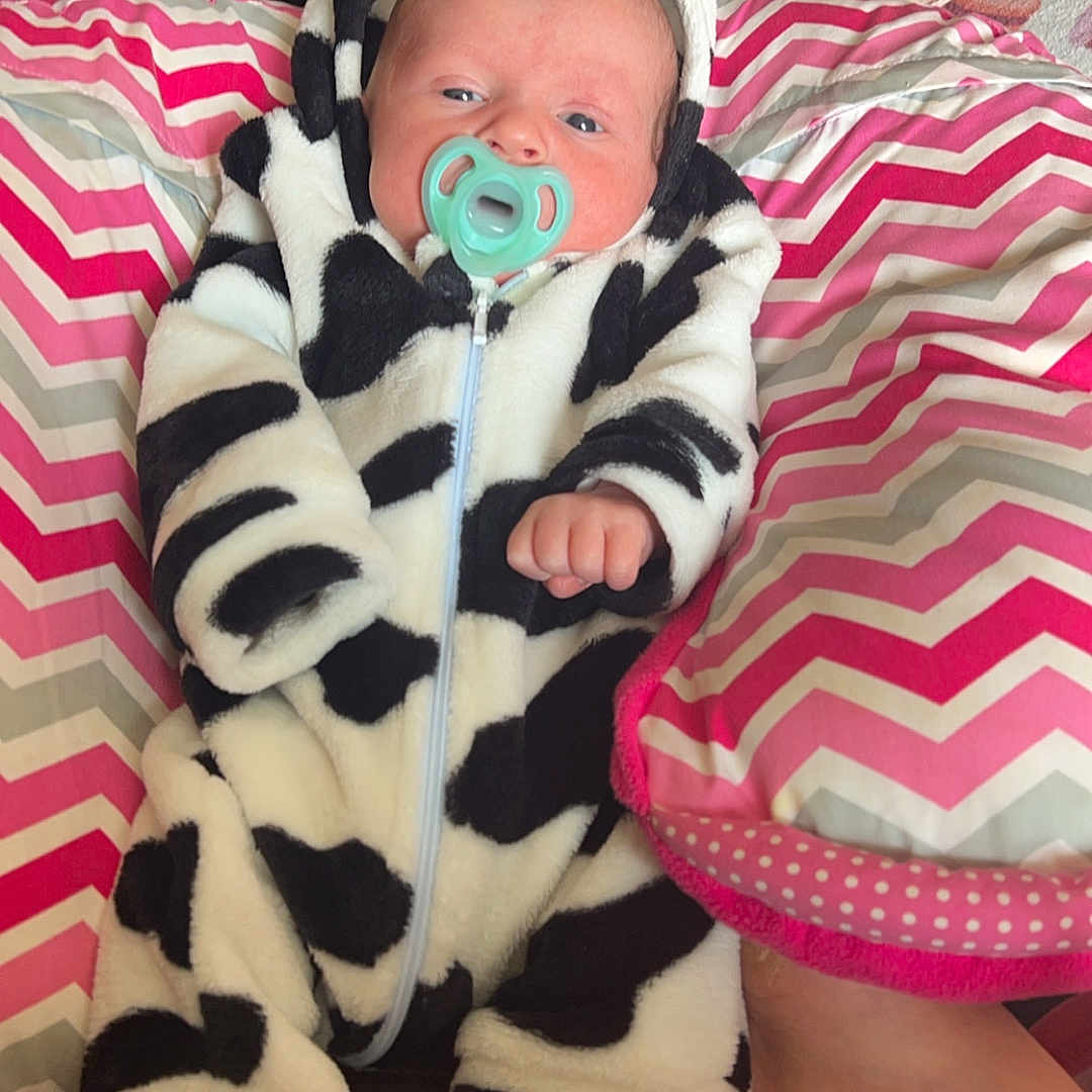 Noah is registered to the contest to win money with this photo: baby, bed, blanket, clothing, couch, cushion, face, furniture, glove, hat, head, homedecor, newborn, person, photography, pillow, portrait, quilt, sleeping, toy