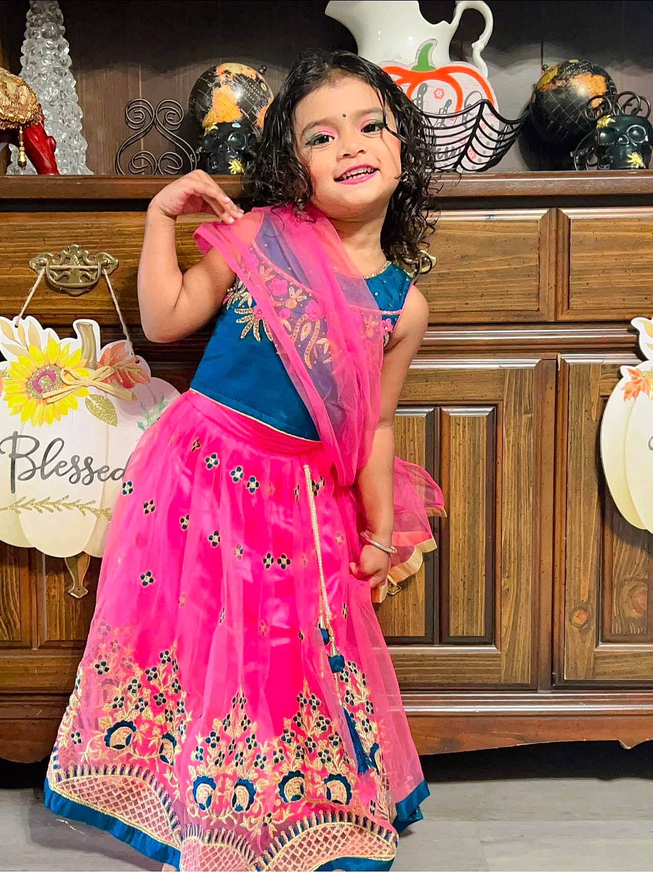 Armani is registered to the contest to win money with this photo: abdomen, cabinetry, child, entertainment, event, fashion, fashion_design, formal_wear, happy, joy, magenta, peach, person, pink, sleeve, smile, tableware, textile, thigh, trunk