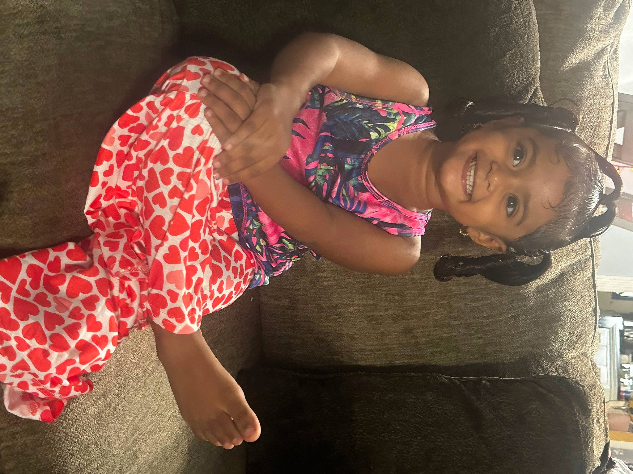 Armani is registered to the contest to win money with this photo: black_hair, dress, elbow, finger, flash_photography, fun, happy, human_body, human_leg, joint, joy, leg, leisure, magenta, person, pink, plant, thigh, toddler, tree