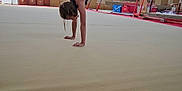 Justine a rejoint le concours — aidez-le/la à gagner de superbes lots ! activity, athlete, balance, child, exercise, fitness, floor, gymnasium, gymnast, gymnastics, handstand, indoor, person, pose, practice, sport_equipment, sports, stretch, training, young