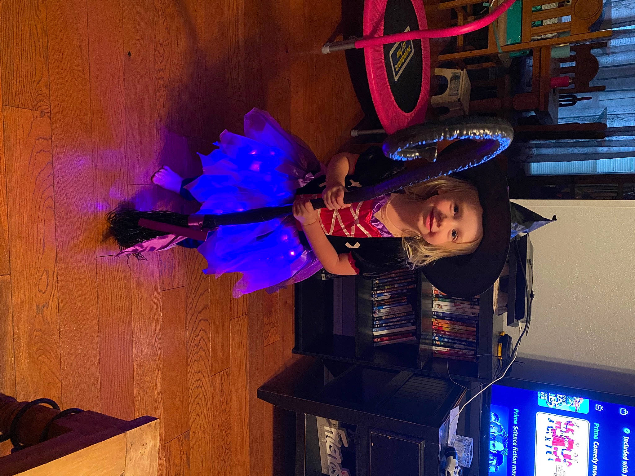 Raven is registered to the contest to win money with this photo: display_device, electric_blue, event, fun, games, hat, headwear, joy, machine, magenta, person, plant, purple, recreation, room, tree, violet