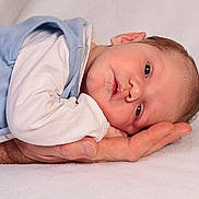 Sawyer participe au concours pour gagner de l'argent avec cette photo : baby, blue_clothing, calm, child, closeup, cute, eyes, face, hand, infant, lying_down, newborn, newborn_baby, peaceful, person, portrait, resting, skin, soft_texture, white_background