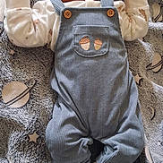 Ynoa participe au concours pour gagner de l'argent avec cette photo : baby, sleeping, blanket, blue_overalls, knitted_booties, white_hat, infant, cute, cozy, patterned_blanket, acorn_embroidery, soft_texture, peaceful, small_hands, newborn, portrait, laying_down, indoors, warm_clothing, adorable