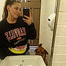 Bruce is registered to the contest to win money with this photo: bathroom, brick_wall, brown_dog, casual, curious, dog, door, earphones, faucet, hand, indoor, mirror, person, pet, phone, reflection, selfie, sink, sweatshirt, woman