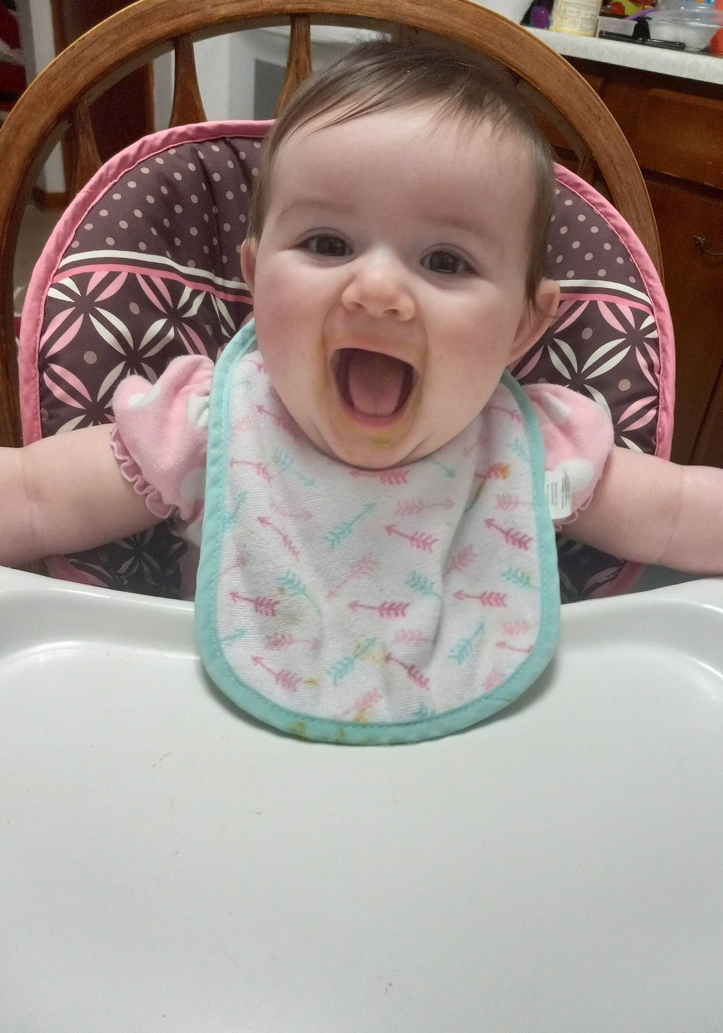 Ellie Mae joined the competition — help win amazing prizes! baby, baby_laughing, baby_products, baby_toddler_clothing, bib, cabinetry, cheek, child, comfort, fun, happy, iris, lip, mouth, person, pink, sitting, skin, sleeve, smile