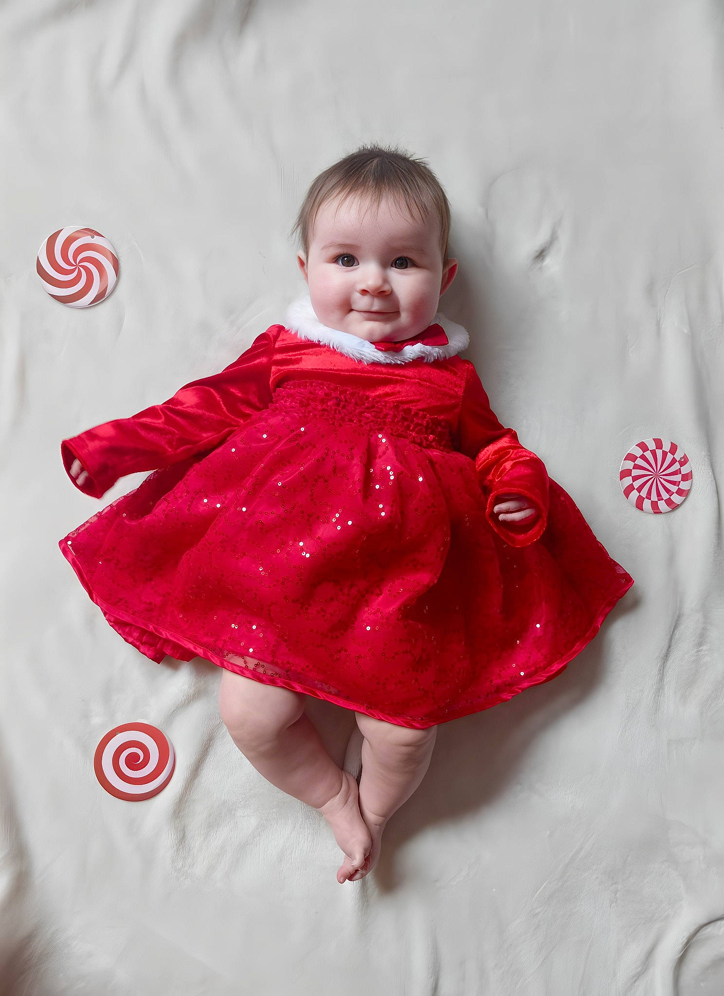 Ellie Mae is registered to the contest to win money with this photo: baby, baby_toddler_clothing, child, collar, comfort, day_dress, dress, embellishment, happy, human_leg, joy, leg, linens, magenta, pattern, person, pink, sitting, skin, sleeve