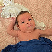 Diana is registered to the contest to win money with this photo: arm, baby, bare_chest, bedding, blanket, clothes, crib, eyes, face, gaze, hair, infant, lying_down, newborn, pattern, sheet, shirt, skin, soft_texture, towel