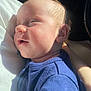 baby, infant, sleeping, blue_clothing, closeup, face, skin, hair, child, person, portrait, sunlight, shadow, relaxation, peaceful, soft_texture, warm_light, indoors, cuddle, comfort